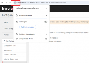 imagem do Webmail destacando o ícone de informações do site. O ícone está posicionado na área superior da tela, ao lado esquerdo da barra que contém o link do site. A ação associada ao ícone é “ver informações do site”.