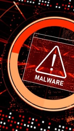 A ilustração mostra um alerta de malware que está prestes a invadir um sistema. O aviso está em vermelho, no centro da tela, sobre uma série de pequenas linhas de códigos de programação.